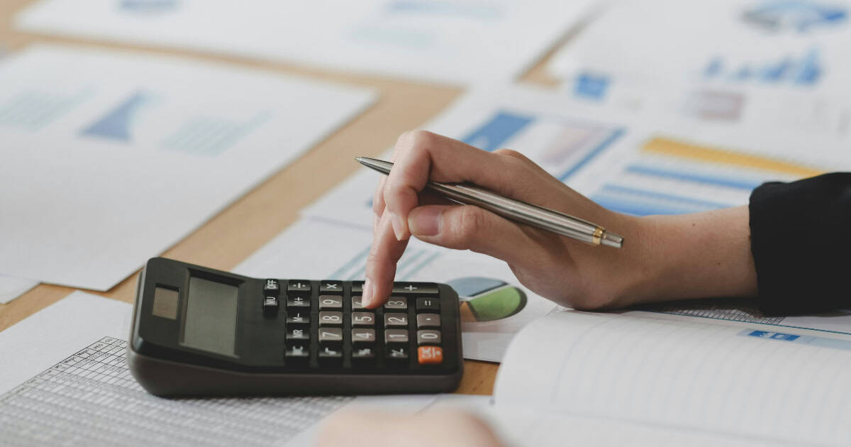 Woman's hand with calculator